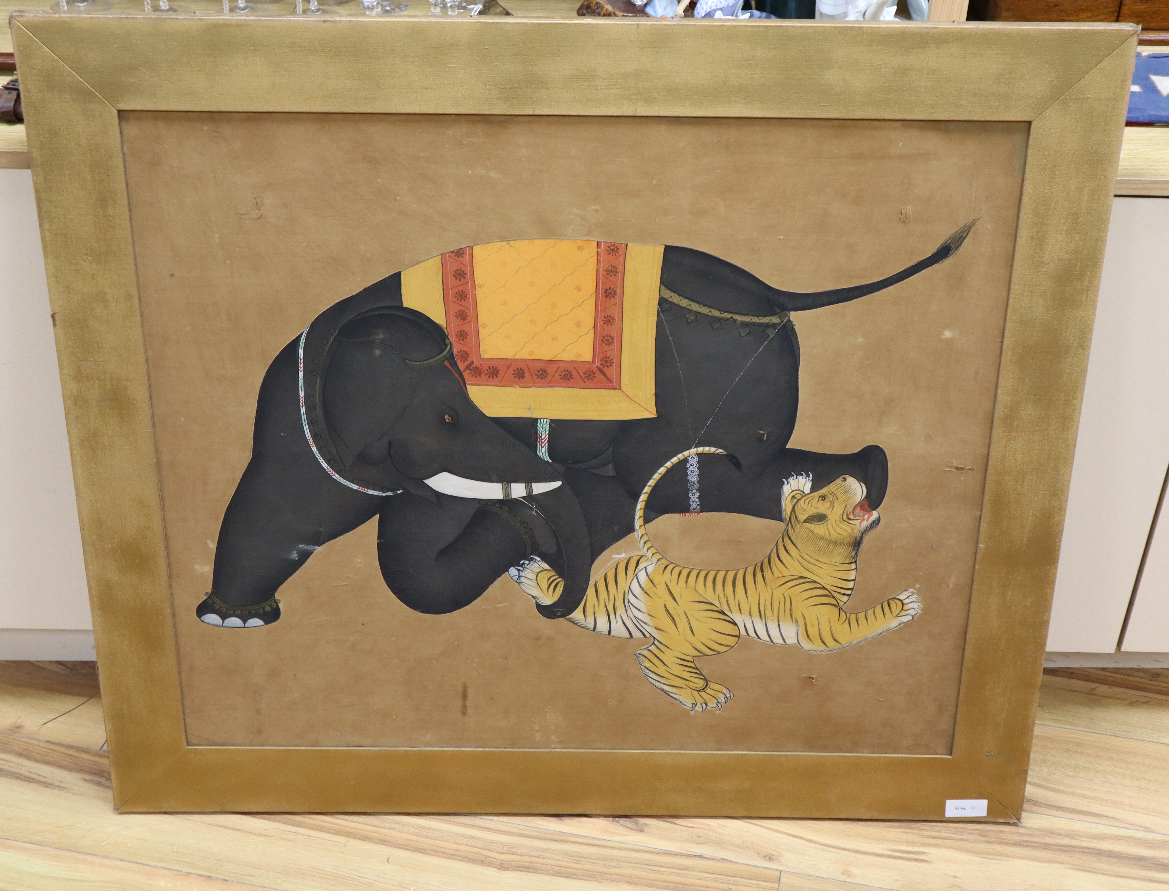 Indian School, oil on silk, Elephant attacking a tiger, 79 x 94cm